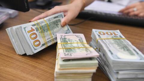 Tỷ giá trung tâm tăng nhẹ, USD trong ngân hàng thương mại giảm mạnh