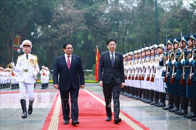 Thủ tướng Chính phủ Phạm Minh Chính chủ trì lễ đón Thủ tướng Singapore Lawrence Wong. Ảnh: TTXVN
